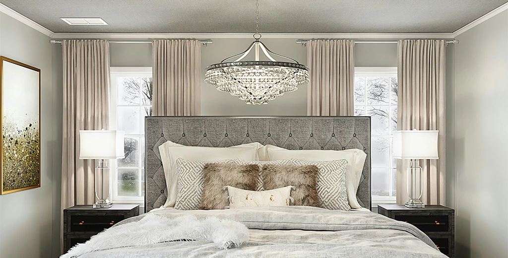 Bedroom with a chandelier and upholstered headboard